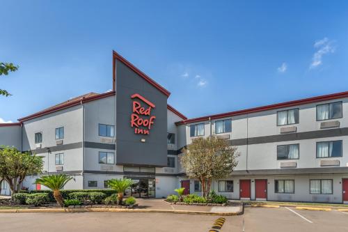 a hotel with a sign for a red roof inn at Red Roof Inn Houston Brookhollow in Houston