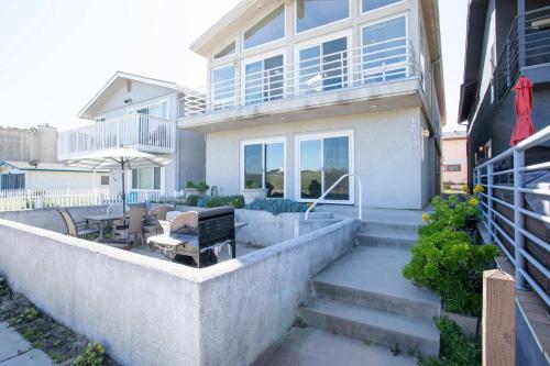 a house with stairs leading to a patio at Oceano Lagoon in Oceano
