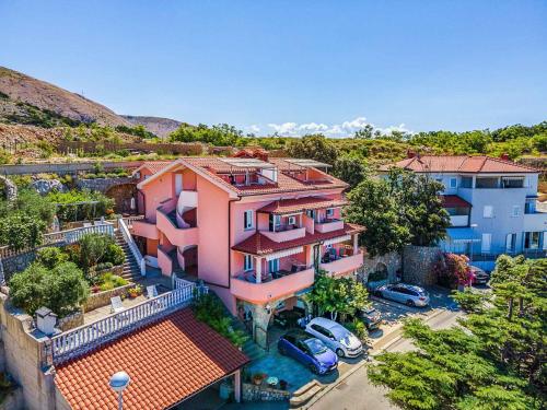 an aerial view of a house with a parking lot at Apartments in Stara Baska - Insel Krk 34433 in Stara Baška