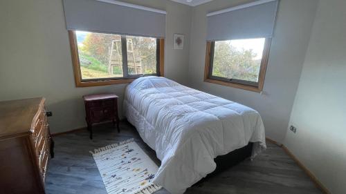 Ένα ή περισσότερα κρεβάτια σε δωμάτιο στο Oceana Suites Santa Inés, Coyhaique