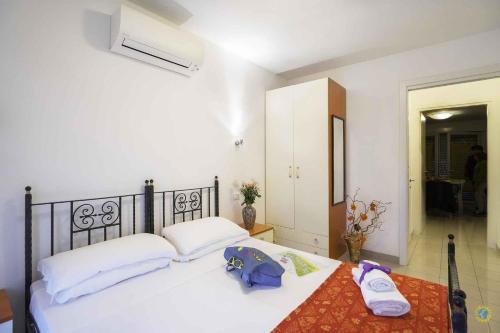 Ένα ή περισσότερα κρεβάτια σε δωμάτιο στο Apartments in Lignano 21760