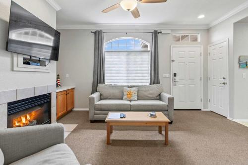 a living room with a couch and a fireplace at Coastal Cutie in Oceano