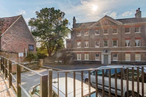 a van parked in front of a brick building at Hubert House Guesthouse in Dover