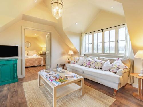 a living room with a couch and a table at 1 Bed in Horsham 86961 in Rudgwick