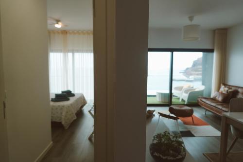 a living room with a view of a living room at Madeira Home at Cliff Residence in Santa Cruz