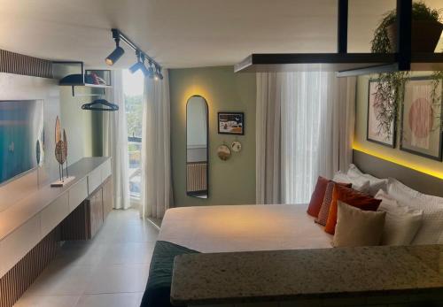 Ένα ή περισσότερα κρεβάτια σε δωμάτιο στο Sonne Flat Aurora - Frente Mar no Bessa