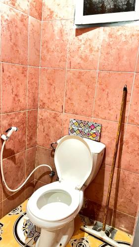 a bathroom with a toilet in a room at Wanasa House in Dahab