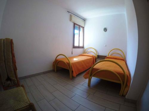 Ένα ή περισσότερα κρεβάτια σε δωμάτιο στο Apartment in Rosolina Mare 35637