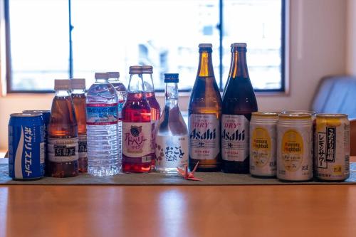 a group of bottles of beer and drinks on a table at Dantokan Kikunoya in Otsu