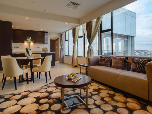 a living room with a couch and a table at The Concord Hotel & Suites in Nairobi