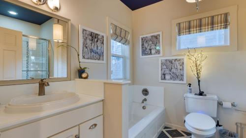 Koupelna v ubytování Beachside Retreat w Hot Tub Balcony Dining Blue-Ceiling Charm Sea Curred by AvantStay