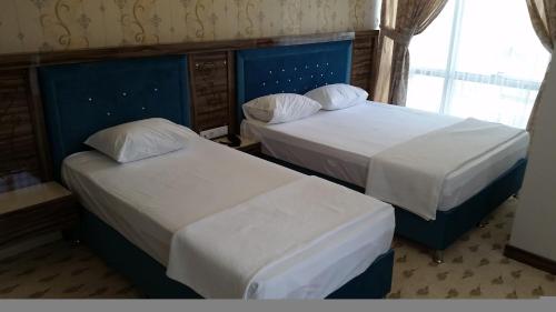 Katil atau katil-katil dalam bilik di Elazig Gunay Hotel