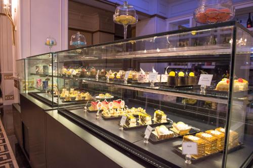 a display case filled with lots of different types of food at Graaf Hotel in Baku