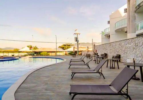 Bazén v ubytování Apartamento em Resort frente ao Mar nebo v jeho okolí