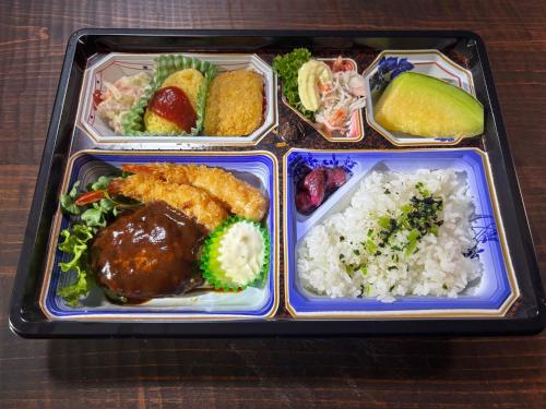 a tray of food with rice and meat and vegetables at SEN HAVEN Sakurai in Shingu