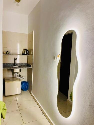 a kitchen with a wall with a hole in it at Shark house dahab in Dahab