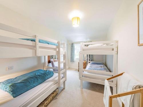 a room with two bunk beds and a staircase at 3 Bed in Portinscale SZ335 in Portinscale