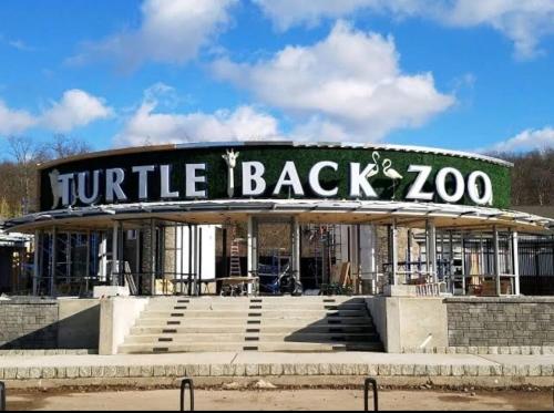 a round building with a sign that reads turtle back zoo at Cozy Retreat Near EWR with NYC access in Newark