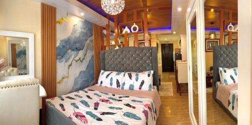 Een bed of bedden in een kamer bij J&J Havenstay Ananda Square