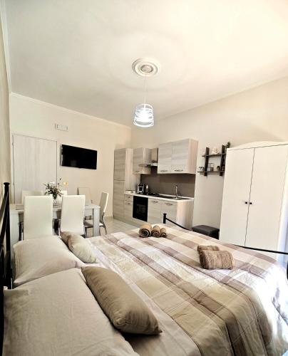 a large bedroom with two beds and a kitchen at Da Nonno Mario in Bagnoli Irpino