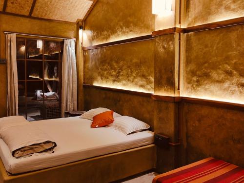 Postel nebo postele na pokoji v ubytování Sapoi Tea Farms 1914, Heritage Homestay