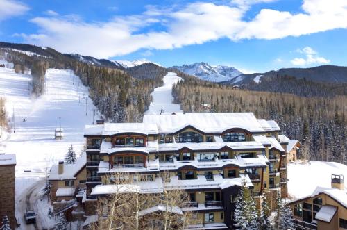 a hotel in the mountains with snow on the ground at Relais & Chateaux Lumiere by Dunton in Telluride