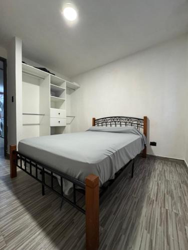 a bedroom with a large bed in a room at Arisbeth V in Panama City
