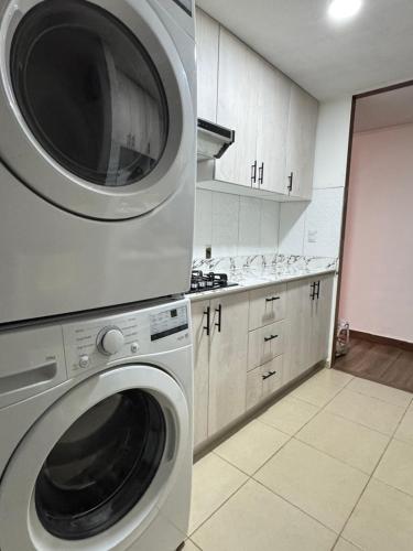 a kitchen with a washer and a washing machine at Arisbeth V in Panama City