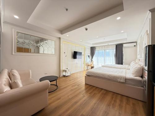 Ένα ή περισσότερα κρεβάτια σε δωμάτιο στο TMS Quy Nhơn Grand SeaView Condotel