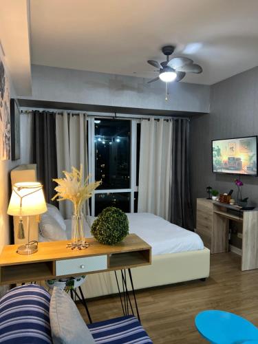 TV a/nebo společenská místnost v ubytování Abreeza Place Alveo