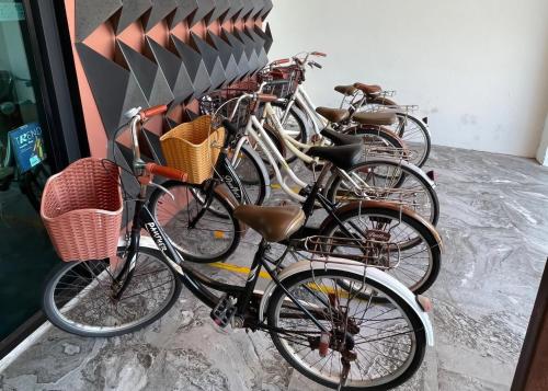 a row of bikes parked next to each other at Maya Phuket Airport Hotel-Naiyang Beach in Nai Yang Beach