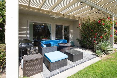 a patio with a pergola and chairs and a table at Blacklake Resort Vacation Rental Nestled on the 9t in Los Berros