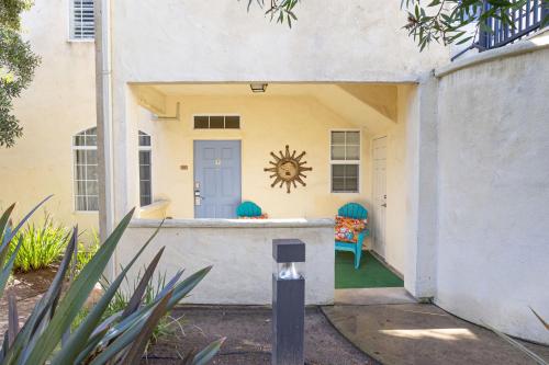 a entry to a house with a blue door at Tide & Treasures in Oceano
