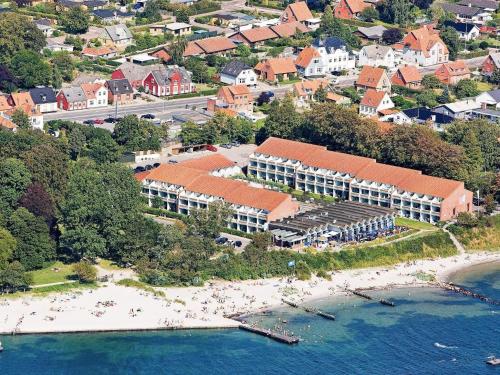an aerial view of a resort on a beach at 6 person holiday home on a holiday park in Faaborg in Fåborg