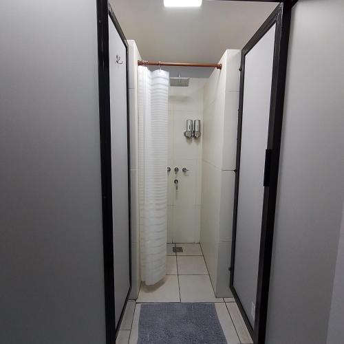 a bathroom with a walk in shower and a toilet at El Balcón de la Tata Hostel in San Salvador de Jujuy