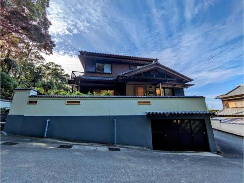 a house with a garage in front of it at Shinra - Vacation STAY 29374v in Ise