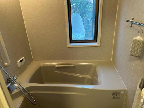 Koupelna v ubytování 海まで徒歩2分大切なペットと自由な旅を