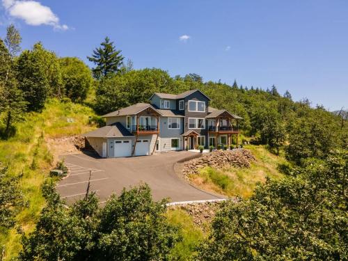 an aerial view of a large house on a hill at Panoramic River Views - Nature Framed in Every Window in Kelso
