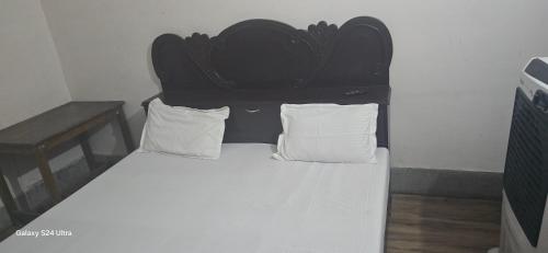 Postel nebo postele na pokoji v ubytování Hotel O Gangay