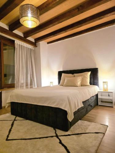 a bedroom with a large bed in a room at appartement confortable en centre ville in Montreux