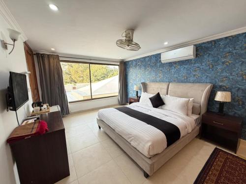 Ένα ή περισσότερα κρεβάτια σε δωμάτιο στο Rhodium Hotel ONE