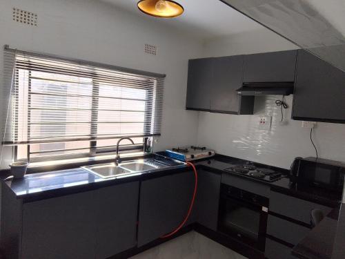 Afbeelding uit fotogalerij van T&M apartments in Ndola