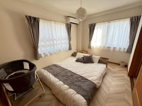 Ένα ή περισσότερα κρεβάτια σε δωμάτιο στο Nagoya west2