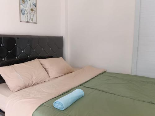 Ένα ή περισσότερα κρεβάτια σε δωμάτιο στο Pulmo Guesthouse Bromo