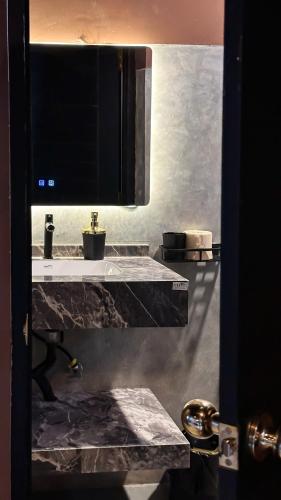 a kitchen with a sink and a counter top at Arana Weligama in Weligama