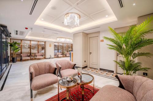 a waiting room with chairs and a table at Grand Hilarium Hotel in Istanbul