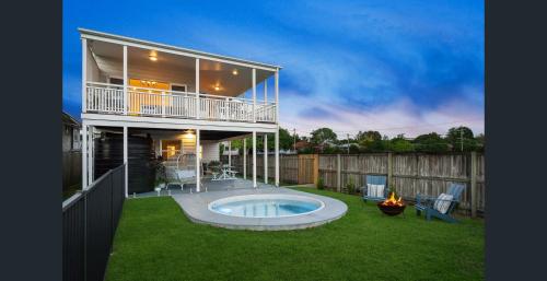 a house with a swimming pool in the yard at Parkside Family Haven - 5bdrm in Brisbane