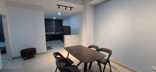 a dining room with a table and chairs at Wonder Villa in Bandar Penawar