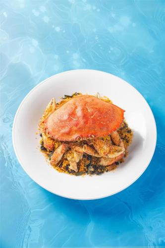a white plate of food on a blue table at Kempinski Hotel Hangzhou in Hangzhou