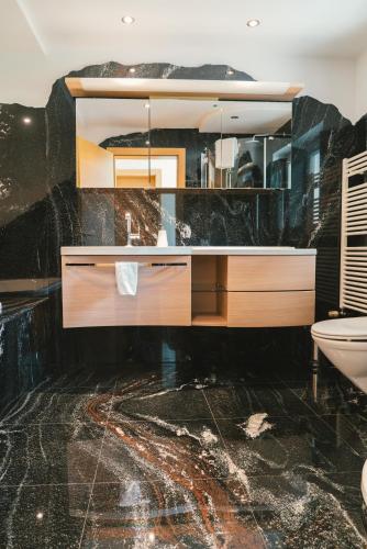 a bathroom with a sink and a mirror at Relax in Thaur in Thaur